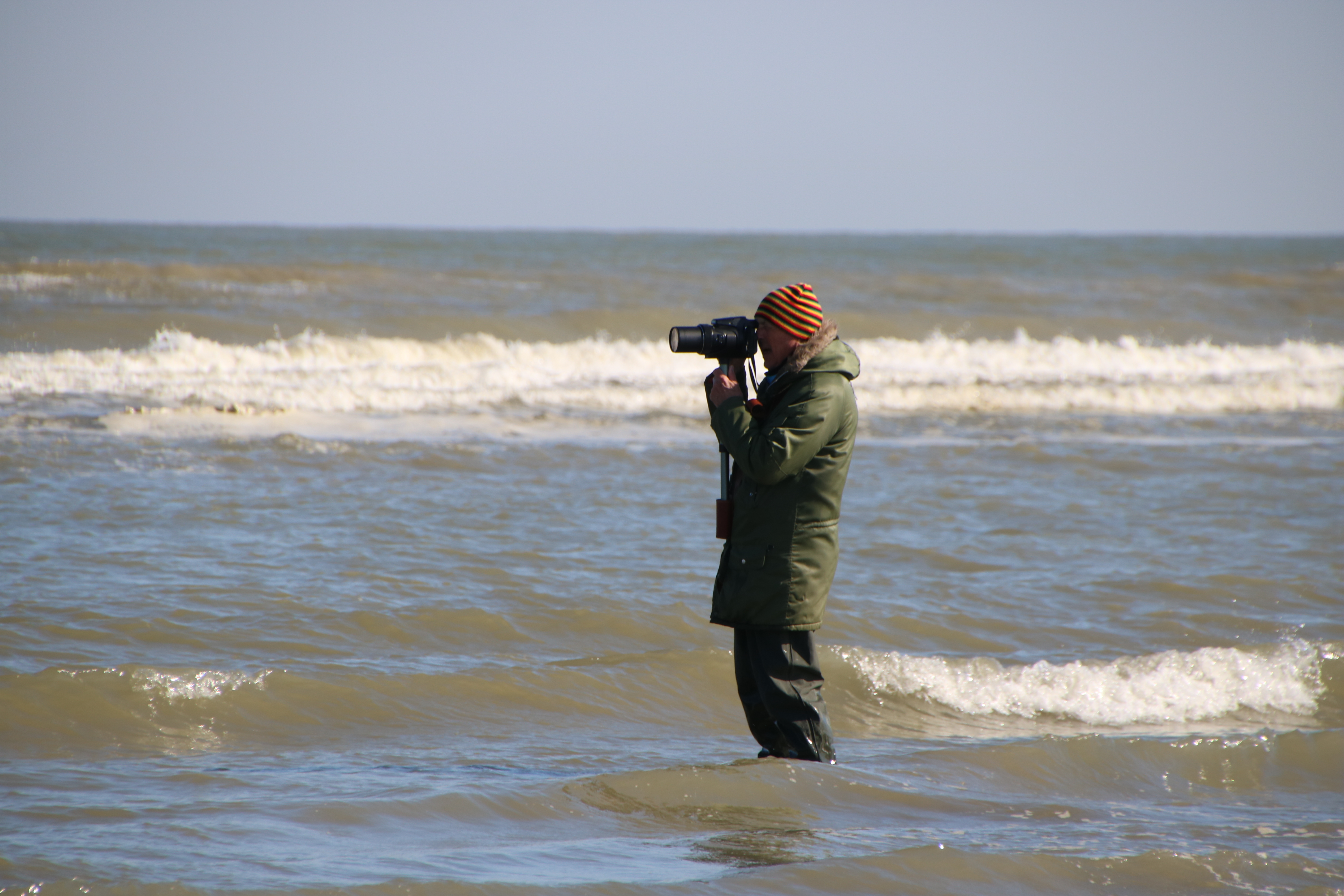 Henri taking photos at the sea.